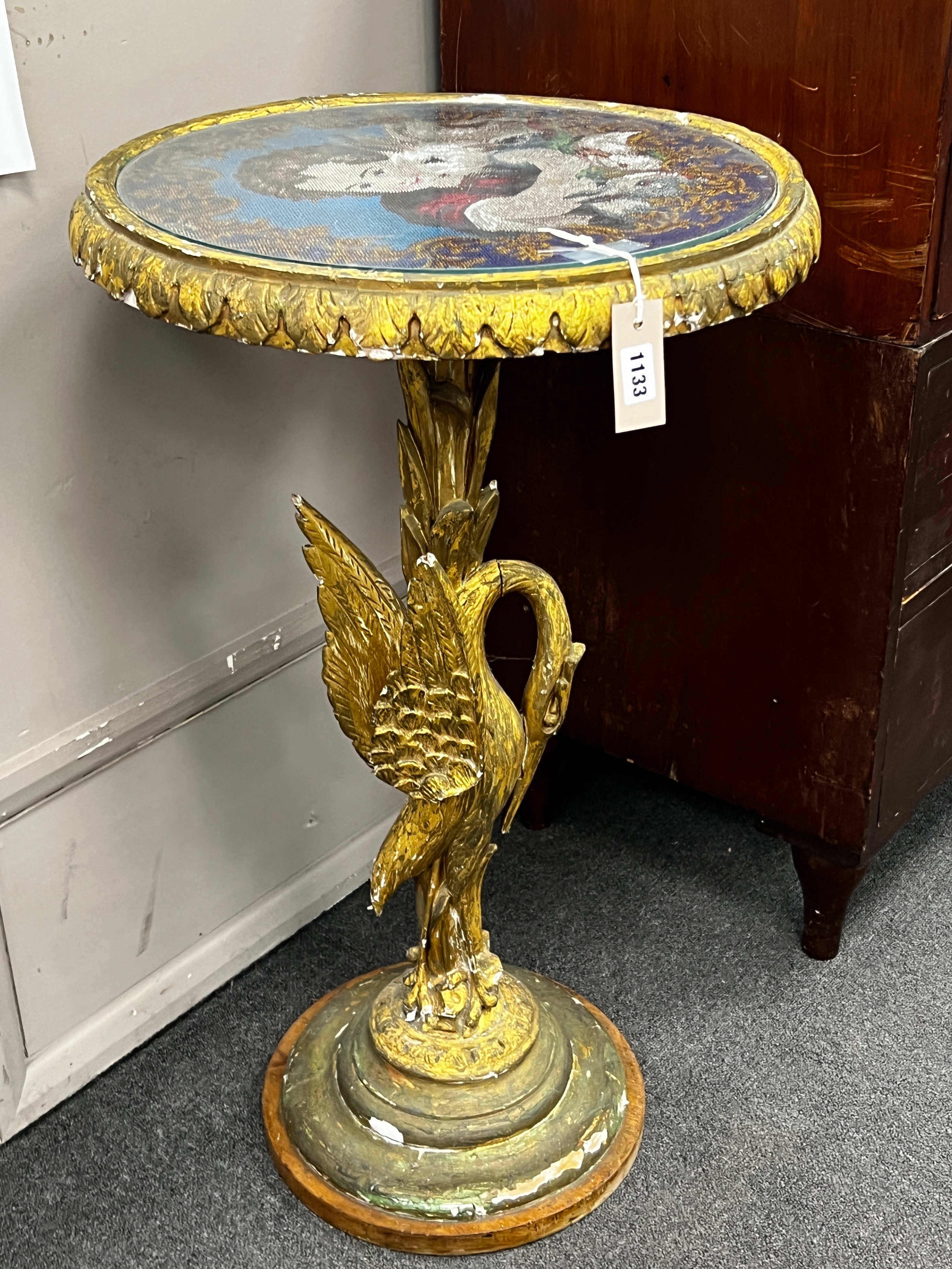 A Victorian giltwood and composition circular centre table with polychrome beadwork top on a carved heron stem and circular platform, diameter 49cm, height 82cm